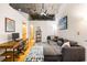 Open-concept living room with a large sectional sofa and an exposed ceiling at 3235 Roswell Ne Rd # 505, Atlanta, GA 30305
