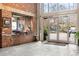 Modern lobby with tiled floors, a brick reception desk, and bright glass doors at 3235 Roswell Ne Rd # 505, Atlanta, GA 30305