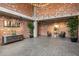 Spacious lobby with exposed brick walls, tiled floor, and stylish furnishings at 3235 Roswell Ne Rd # 505, Atlanta, GA 30305