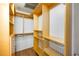 Organized walk-in closet with custom wood shelving and drawers at 3235 Roswell Ne Rd # 505, Atlanta, GA 30305