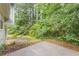 Backyard with a patio and lush landscaping, offering privacy and space for outdoor enjoyment at 2426 Corner Shoals Dr, Decatur, GA 30034