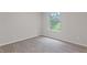 This bright bedroom features a large window, plush carpeting, and neutral wall paint at 2426 Corner Shoals Dr, Decatur, GA 30034