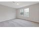 Spacious bedroom features plush gray carpeting, neutral paint and plentiful light from the large windows at 2426 Corner Shoals Dr, Decatur, GA 30034