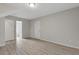 Spacious bedroom with wood-look floors, neutral walls, and a private bathroom at 2426 Corner Shoals Dr, Decatur, GA 30034