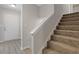Inviting foyer featuring hardwood flooring and staircase with neutral carpeting leading upstairs at 2426 Corner Shoals Dr, Decatur, GA 30034