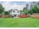 Expansive backyard with lush lawn, a wooden fence, and a spacious deck perfect for outdoor entertaining at 281 Lakeshore Ne Dr, Marietta, GA 30067