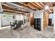 Unfinished basement featuring exposed ceiling and ductwork, a table and chairs, and white doors at 281 Lakeshore Ne Dr, Marietta, GA 30067
