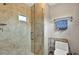 Bathroom featuring a marble shower with glass door and chrome fixtures at 281 Lakeshore Ne Dr, Marietta, GA 30067