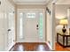 Bright and inviting foyer with beautiful brick flooring, a decorative front door, and elegant trim details at 281 Lakeshore Ne Dr, Marietta, GA 30067