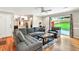 Comfortable living room features a plush gray sectional sofa and access to the backyard at 281 Lakeshore Ne Dr, Marietta, GA 30067