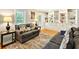 Cozy living room with built-in bookshelves, hardwood floors, and comfortable seating, perfect for relaxing and entertaining at 281 Lakeshore Ne Dr, Marietta, GA 30067