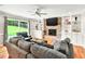 Bright living room with brick fireplace, built-in shelving and sliding door to back yard at 281 Lakeshore Ne Dr, Marietta, GA 30067