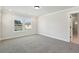 Light-filled bedroom with plush carpeting, a window, and ensuite bath at 5120 Kongoni Ct, Cumming, GA 30041