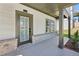 Welcoming front entrance featuring stylish door and covered porch with stone accents at 5120 Kongoni Ct, Cumming, GA 30041