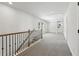 Upstairs hallway with neutral carpet at 5120 Kongoni Ct, Cumming, GA 30041