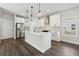 Modern kitchen with white cabinetry, stainless steel appliances, and large island at 5120 Kongoni Ct, Cumming, GA 30041