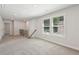 Spacious living room with neutral carpet and plenty of natural light at 5120 Kongoni Ct, Cumming, GA 30041