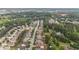 Aerial view of neighborhood homes surrounded by green trees and wooded areas at 8744 Hamil Ct, Douglasville, GA 30135