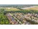 Neighborhood aerial view of homes surrounded by lush green trees and walking trails at 8744 Hamil Ct, Douglasville, GA 30135
