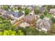 Aerial view of a brick house with a patio in a neighborhood with mature trees at 8744 Hamil Ct, Douglasville, GA 30135