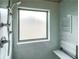 Walk-in shower with frosted window and built-in seat at 8744 Hamil Ct, Douglasville, GA 30135