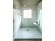 Modern bathroom featuring glass shower with built-in seat and handheld shower head at 8744 Hamil Ct, Douglasville, GA 30135