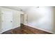 Bedroom with hardwood floors and closet space, and easy access to a bathroom for convenience at 8744 Hamil Ct, Douglasville, GA 30135