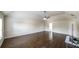 Spacious living room with hardwood floors, ceiling fan, and high vaulted ceiling at 8744 Hamil Ct, Douglasville, GA 30135