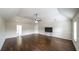 Living room boasts hardwood floors, ceiling fan, and high vaulted ceiling for added space at 8744 Hamil Ct, Douglasville, GA 30135