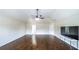 Living room offers hardwood floors, high vaulted ceiling, fan, and is bathed in natural light at 8744 Hamil Ct, Douglasville, GA 30135