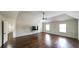 Living room features high vaulted ceiling, hardwood floors, fan, and lots of natural light at 8744 Hamil Ct, Douglasville, GA 30135