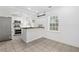 Bright kitchen featuring stainless steel appliances, white cabinets, and butcher block countertop at 1844 Stanton St, Decatur, GA 30032