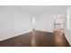 Living room showcasing hardwood floors and a view into the kitchen at 1844 Stanton St, Decatur, GA 30032