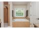 Bathroom featuring shower, soaking tub, and vanity with granite countertop at 2025 Eagle Rdg, Roswell, GA 30076