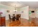 Elegant dining room with hardwood floors, wainscoting, and coffered ceiling, perfect for entertaining at 2025 Eagle Rdg, Roswell, GA 30076