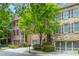 Beautiful townhouses with brick and stone accents, garages, and well-maintained landscaping at 2025 Eagle Rdg, Roswell, GA 30076
