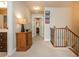 Upstairs hallway with carpeted floors and a decorative table with hardwood trim at 2025 Eagle Rdg, Roswell, GA 30076