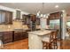 Spacious kitchen with stainless steel appliances, center island, and hardwood floors at 2025 Eagle Rdg, Roswell, GA 30076