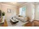 Cozy living room with neutral color palette, hardwood floors, and natural light at 2025 Eagle Rdg, Roswell, GA 30076