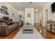 Spacious living room showcasing an entertainment center, hardwood floors, and a comfortable couch at 2025 Eagle Rdg, Roswell, GA 30076