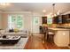 Open-concept living space with a kitchen island and natural light from the window at 2025 Eagle Rdg, Roswell, GA 30076