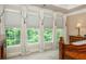 Sunlit main bedroom with window views and custom window treatments at 2025 Eagle Rdg, Roswell, GA 30076