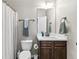 Cozy bathroom features a vanity with a white countertop and dark wood cabinets, along with a toilet and shower at 3386 Vintage Se Cir # 8, Smyrna, GA 30080