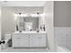 Bright bathroom features a double sink vanity with marble floors and modern lighting at 3386 Vintage Se Cir # 8, Smyrna, GA 30080