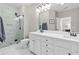 Bright bathroom features a double sink vanity, marble floors, and glass enclosed shower at 3386 Vintage Se Cir # 8, Smyrna, GA 30080