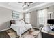 Inviting bedroom features a tray ceiling, plush bedding, and abundant natural light at 3386 Vintage Se Cir # 8, Smyrna, GA 30080