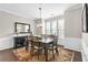 Dining room boasts natural light, wainscoting, and elegant chandelier at 3386 Vintage Se Cir # 8, Smyrna, GA 30080