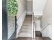 Bright foyer showcasing stairs, white wainscoting, and wood floors for a welcoming entrance at 3386 Vintage Se Cir # 8, Smyrna, GA 30080