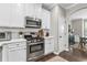 Stylish kitchen showcases white cabinets, stainless steel appliances, and a marble backsplash at 3386 Vintage Se Cir # 8, Smyrna, GA 30080