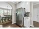Open kitchen adjacent to a dining area, featuring stainless steel appliances and hardwood floors at 3386 Vintage Se Cir # 8, Smyrna, GA 30080